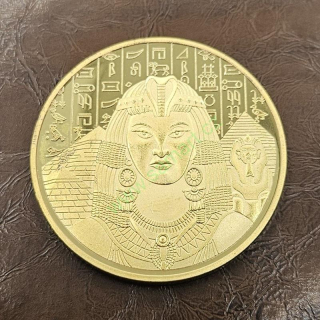 Egyptská mince s Kleopatrou